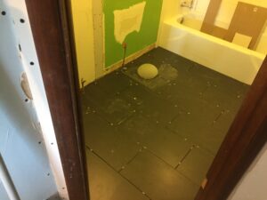 Black stone tiles for the bathroom flooring