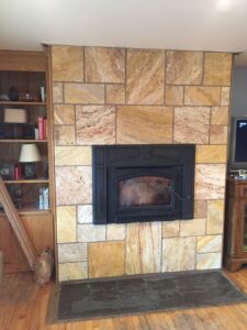 A fireplace and stone chimney